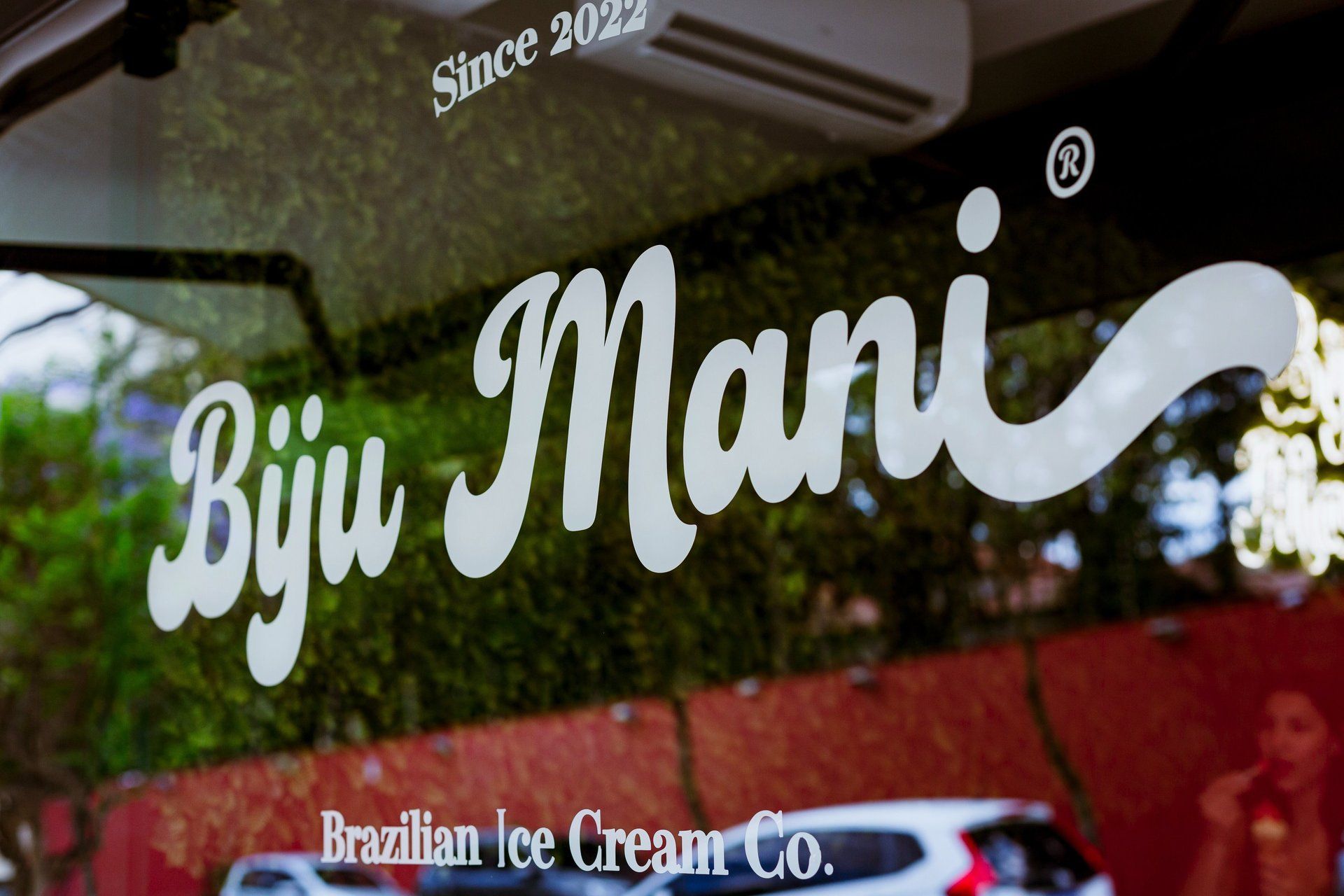The shop window lettered Biju Mani, Brazilian Ice Cream Co., Since 2022