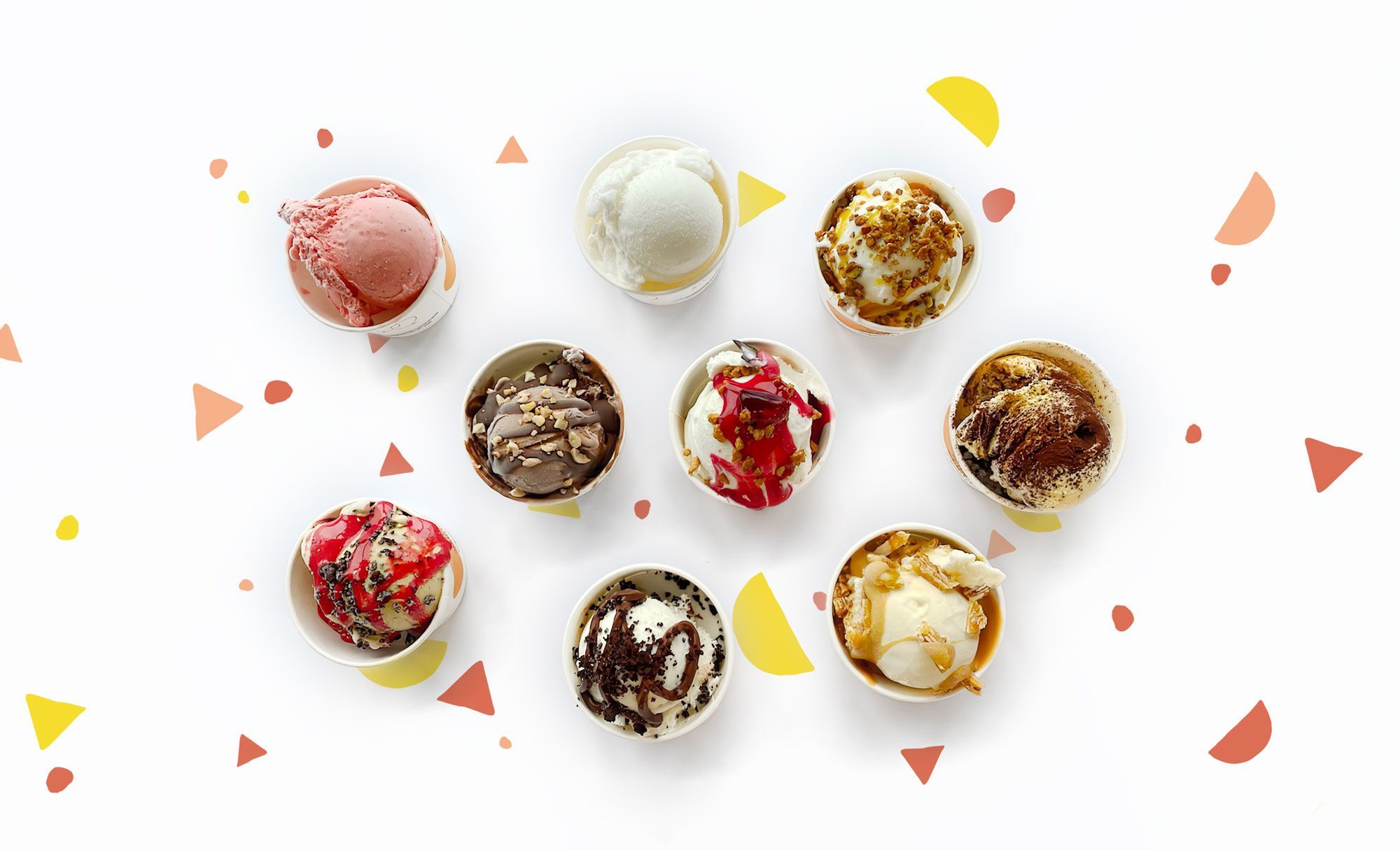 Nine cups of gelato photographed from above on a white ground, each with a different topping
