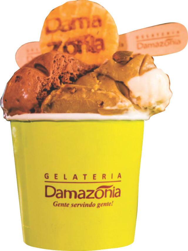 A yellow tub of Damazonia gelato piled with scoops and branded wooden spoons
