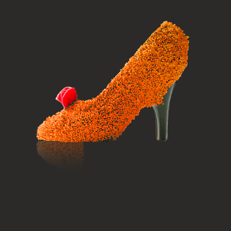 A high-heeled shoe modelled in ice cream and chocolate, the upper covered in orange sugar beads